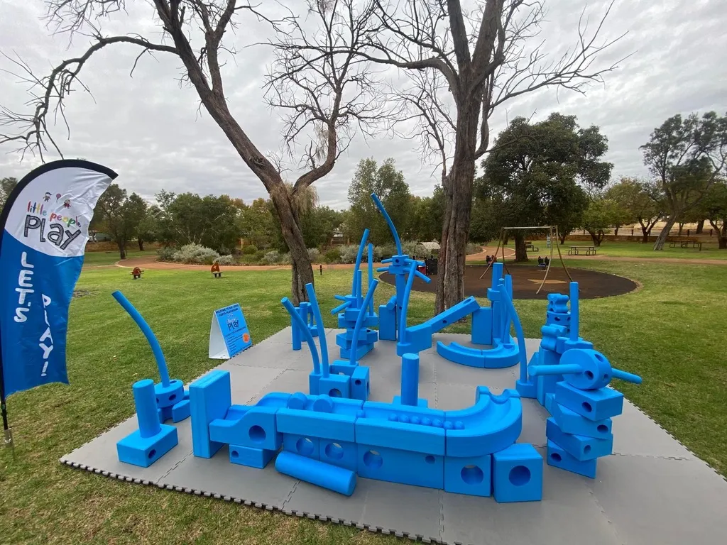 Big Blue Blocks set up on grass at a community event